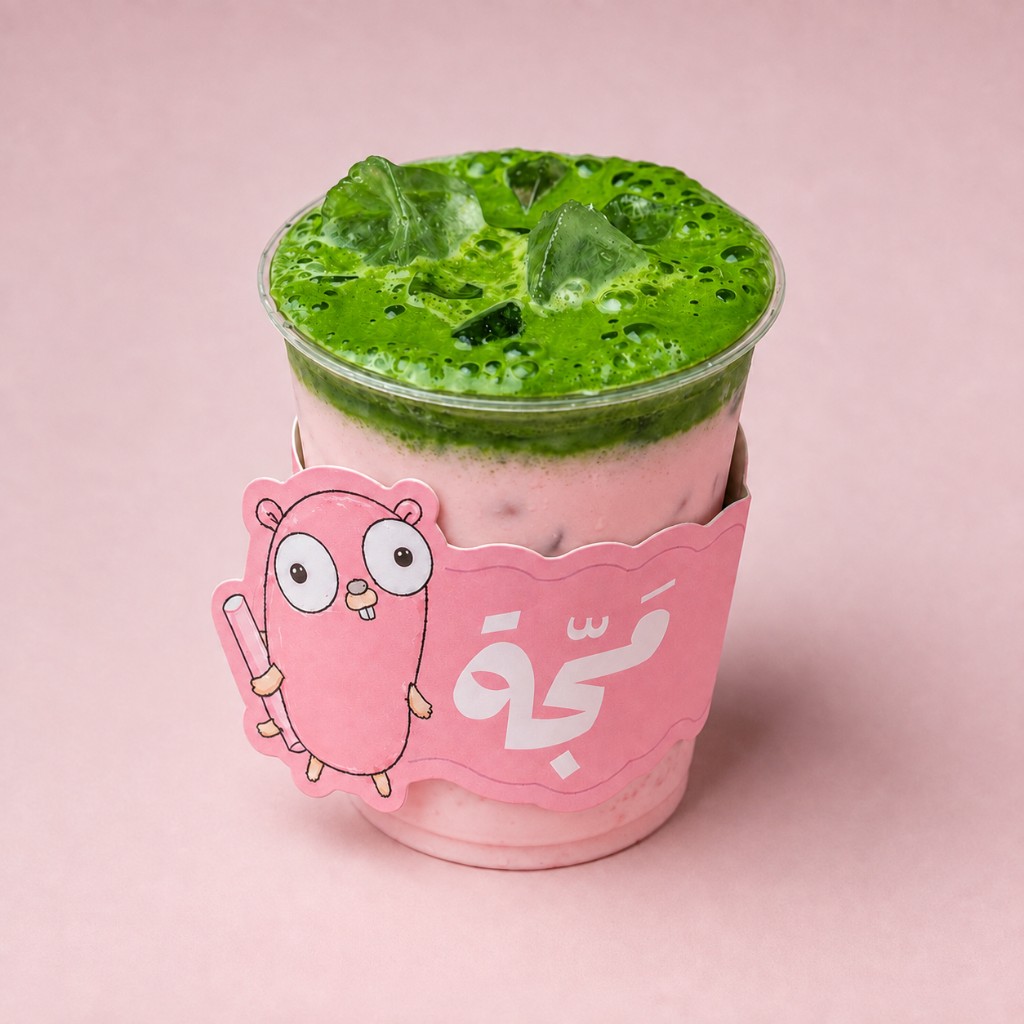 Iced strawberry matcha latte with pink milk and green foam